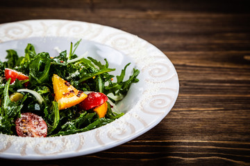 Greek salad on wooden background