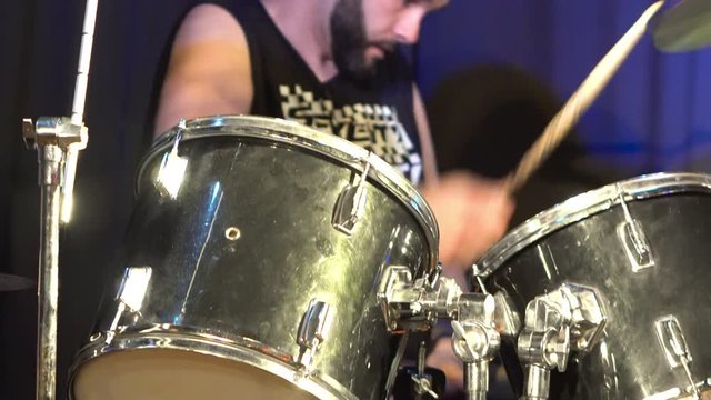 Musician Playing Drums And Cymbals At Concert .