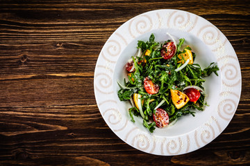 Greek salad on wooden background