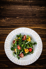 Greek salad on wooden background