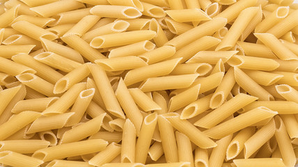 Penne pasta in in quantities - macaroni texture