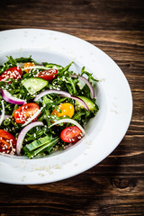 Greek salad on wooden background