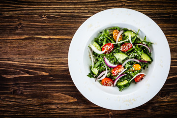Greek salad on wooden background
