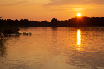 Beautiful summer landscape with sunset on the river.