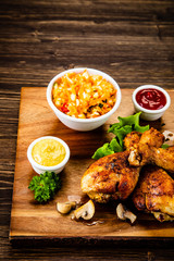 Grilled chicken drumsticks with vegetables