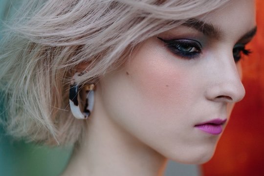 Closeup profile beauty portrait of lovely girl with vintage looking make up