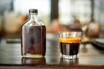 Black coffee in small shot .