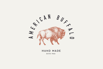 Hand drawing of American bison in retro engraving style. Buffalo in graphic vintage style. Vector logo template for hand-made products. - obrazy, fototapety, plakaty