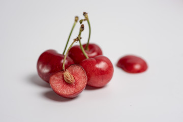 Bunch of fresh cherries on white