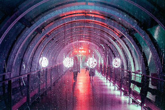 Couple walking through rainy allway