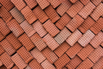 New red clay bricks for masonry building walls. Material for the construction of a new building.