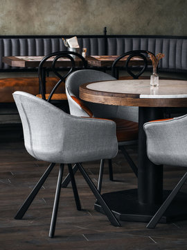 Trendy chairs at table in new cafe
