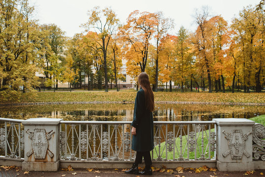 Young woman in autumn park