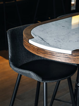Marble tabletop with black chairs