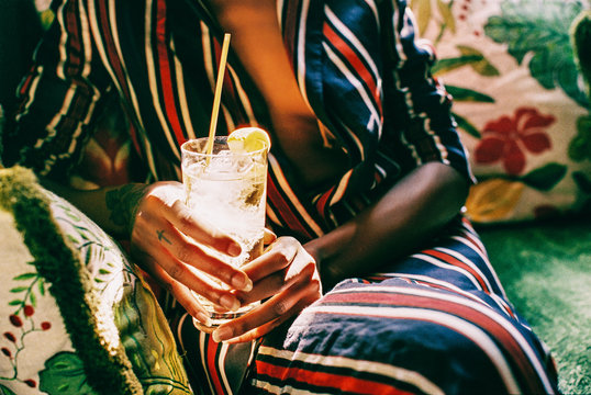 Closeup of Sexy Stylish Young African American Woman Holding Cocktail