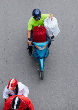 Overlooking the streets of people who riding a motorcycle. In Hanoi, Vietnam