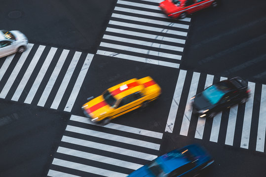 Cars Crossing An Intersection In Tokyo