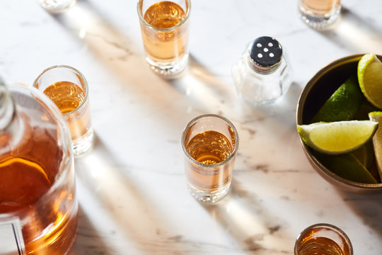 Gold tequila in shots.