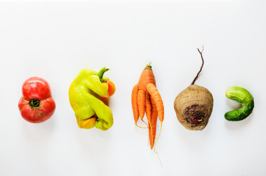 Ugly Vegetables On A White Background. Ugly Food Concept, Flat Lay.