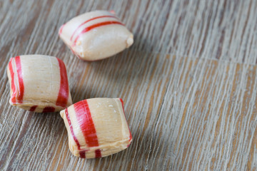Fototapeta na wymiar old Dutch cinnamon candy on wooden table