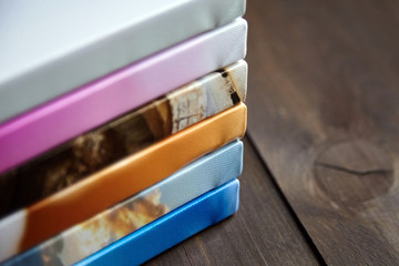Photography canvas prints. Stacked colorful photos with gallery wrapping method of canvas stretching on stretcher bar, lateral side