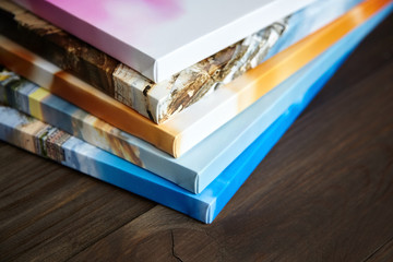 Photography canvas prints. Stacked colorful photos with gallery wrapping method of canvas stretching on stretcher bar, lateral side