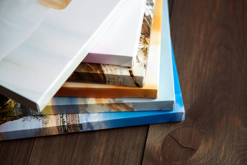 Photography canvas prints. Stacked colorful photos with gallery wrapping method of canvas stretching on stretcher bar, lateral side