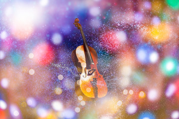 cello in darkness on blurred lights background © Angelov