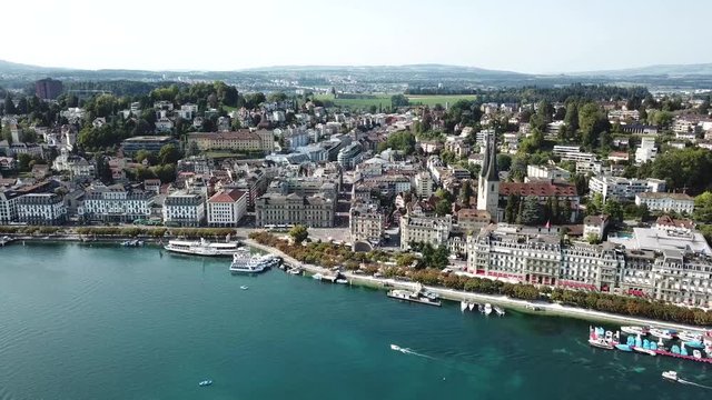 Aerial view of Lucerne, Switzerland, flying above the lake with a view to the city in a beautiful sunny day