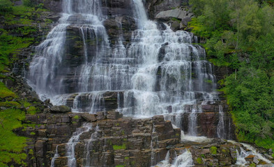 Tvindefossen (also written Tvinnefossen; also called Trollafossen) is a waterfall near Voss, Norway. It is 12 km from Voss on the road to FlÃ¥m.