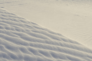 Sand texture background. Creme tint.