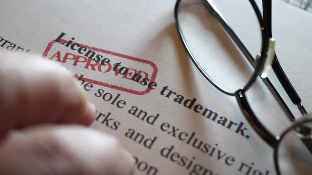 Finger tapping on license to use trademark