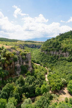 Far view of a couple walking in Incekaya Canyon. Panoramic view of Incekaya Canyon from Kristal Cam Teras, Safranbolu Karabuk, Turkey