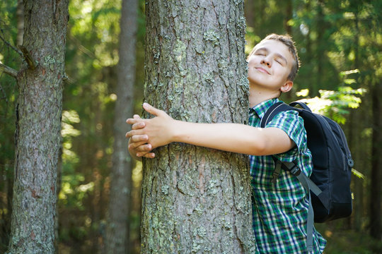 Teenager Boy Hug And Love Big Tree In The Forest Alone In Summer Day