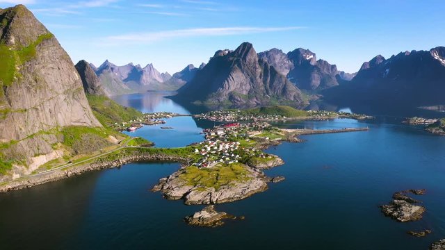 aerial view. flight over the sea,view on Reine and Hamnoya village .the Camera move right to left .Lofoten Islands,Norway.Camera move backward