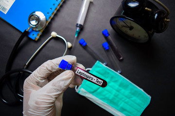 Leptospira - Test with blood sample. Top view isolated on black background. Healthcare/Medical concept