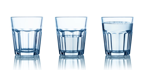Empty,half and full water glasses . Isolated on white