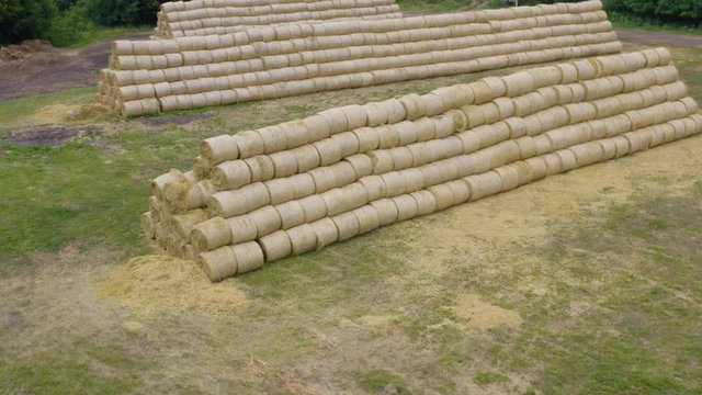 Aerial view of the roll haystacks lying on the field