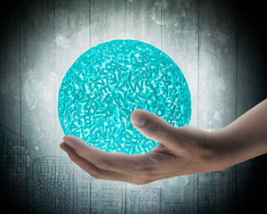 Big data concept. Male hand holding self-illuminated green ball of huge amount 3d letters and numbers with white light and dark background.