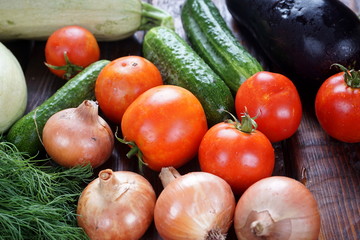 different vegetables on a dark wooden table