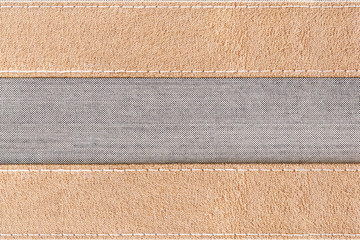 Fototapeta premium gray canvas seam with brown Fabric for use as banner or background