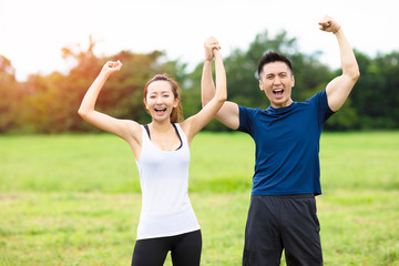 young couple fitness training together outdoors