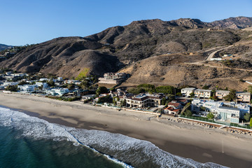 Aerial view of beach estates and homes along Pacific Coast Highway in near Los Angeles in scenic Malibu, California.  