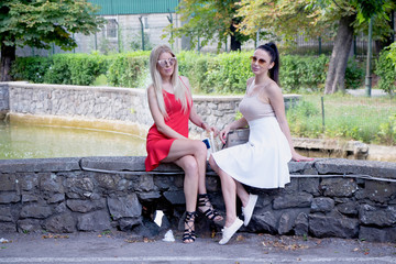 young couple sitting on a bench in the park