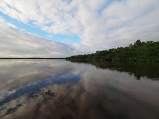 Sunset cloudscape and reflections on Coot Bay in Everglades National Park, Florida on a calm winter evening.