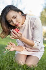 girl with flowers. gorgeous model in the spring garden. the girl near the tree in the spring.