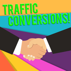 Handwriting text Traffic Conversions. Conceptual photo visitor who has been converted into a client or customer Hand Shake Multiracial Male Business Partners Colleagues Formal Black Suits