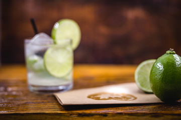 Caipirinha, a typical Brazilian cocktail made with lemon, cachaça and sugar. Brazilian traditional drink, isolated with space for text.