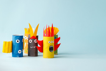 Halloween crafts, paper ghost, monsters on blue paper background with copy space for text....