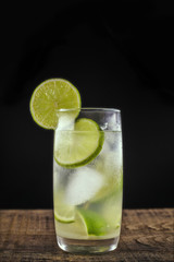 Caipirinha, a typical Brazilian cocktail made with lemon, cachaça and sugar. Brazilian traditional drink, isolated with space for text.